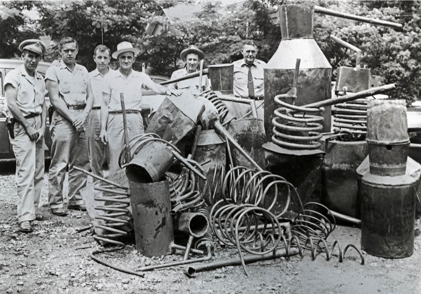 group of men busting moonshine stills in the 1940s